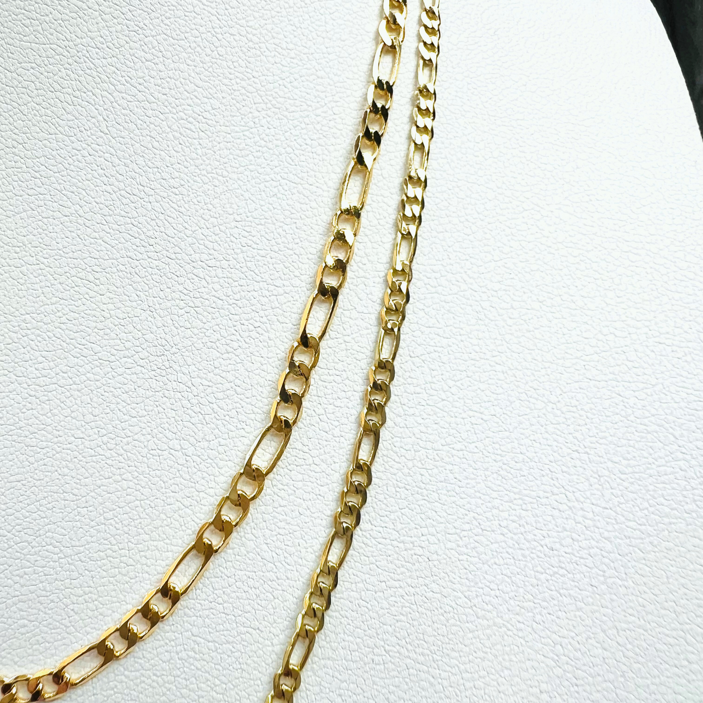 Two gold filled chains stacked. Top Figaro chain is 3mm thick and bottom gold filled chain is 2mm