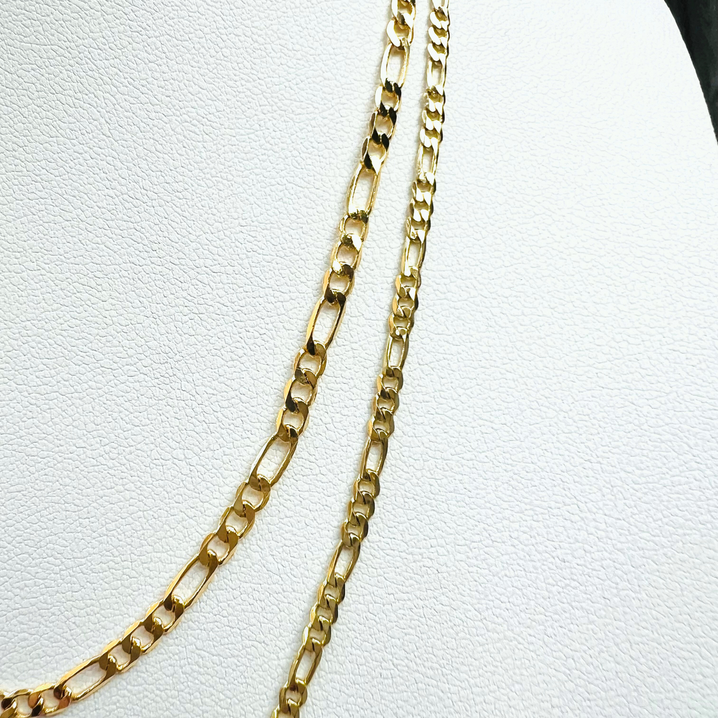 Two gold filled chains stacked. Top Figaro chain is 3mm thick and bottom gold filled chain is 2mm 