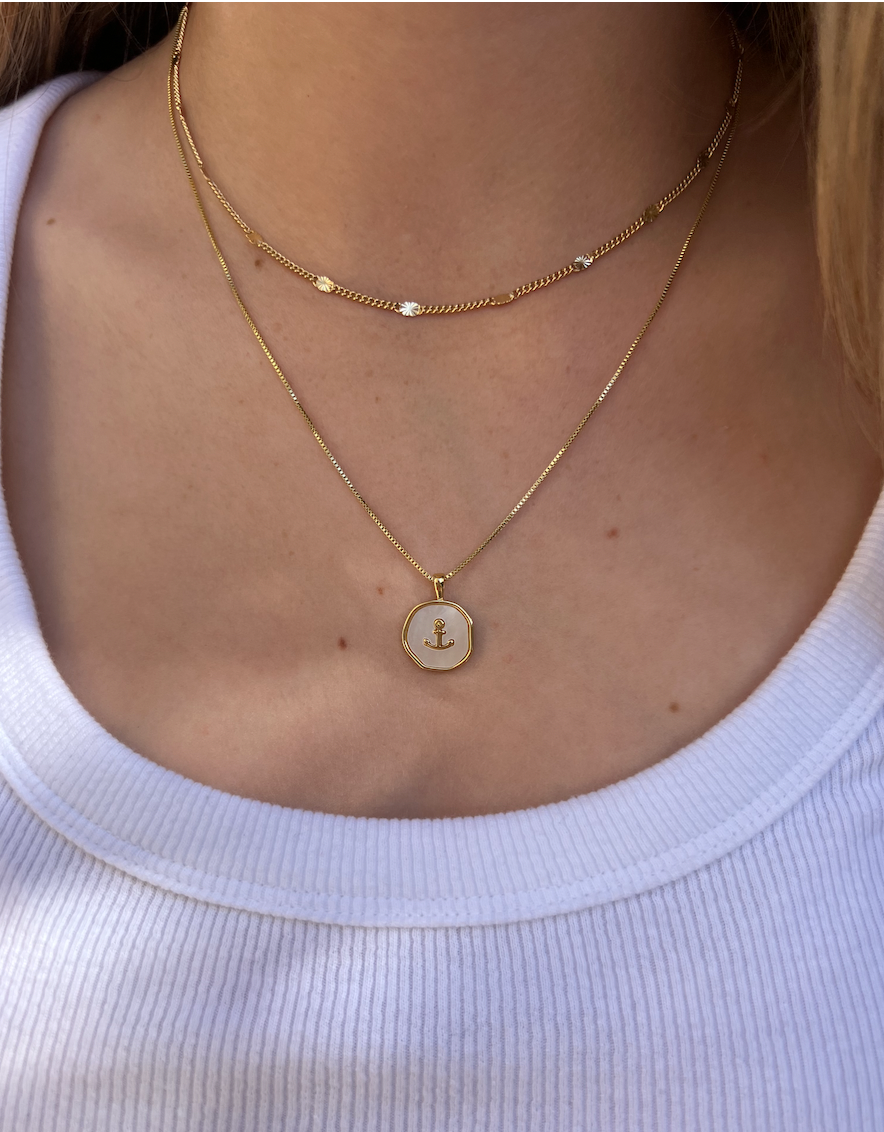 Gold filled chain with dainty gold gleaming bursts. Stacked with our gold filled anchor necklace