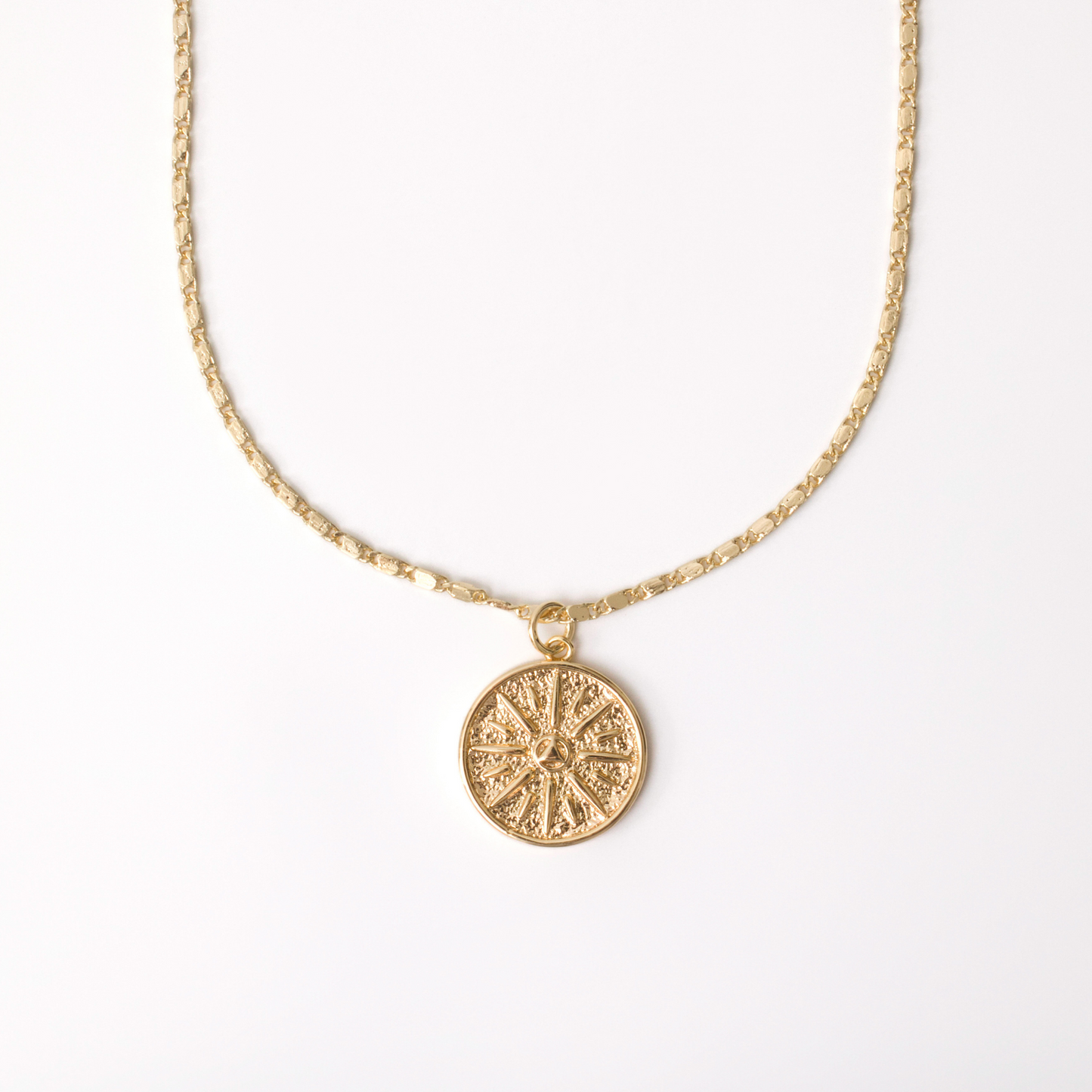 Gold necklace with 18" unique chain and gold coin compass pendant.