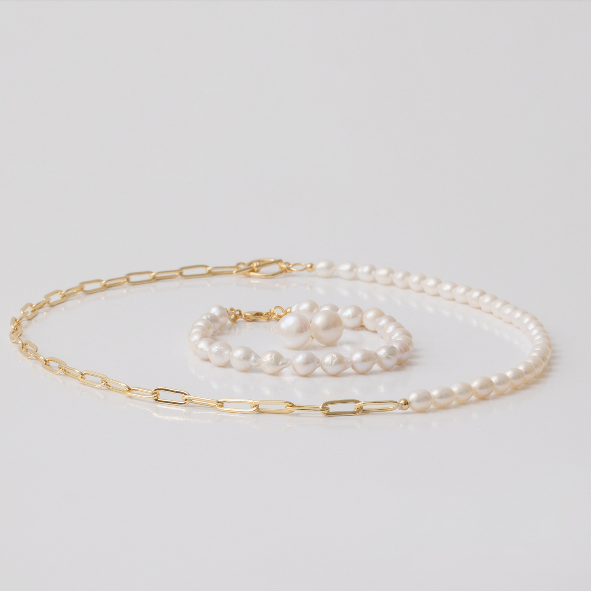 Paperclip chain with freshwater pearl necklace set pictured with bracelet and earrings