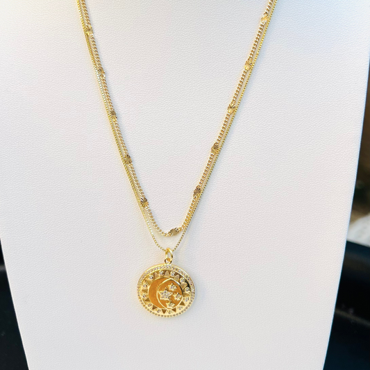 Gold pendant with sun rays, crescent moon and stars. paired stacked with gleaming gold filled chain