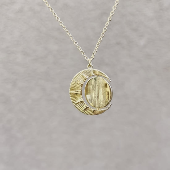 Gold Sun Shine Necklace with spinning middle pendant.