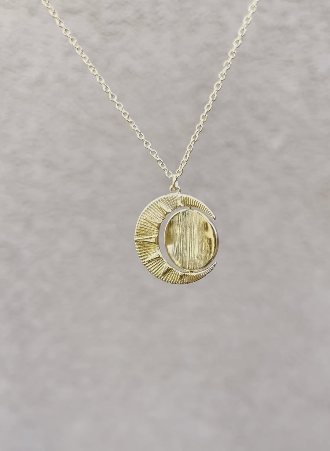 Gold Sun Shine Necklace with spinning middle pendant.